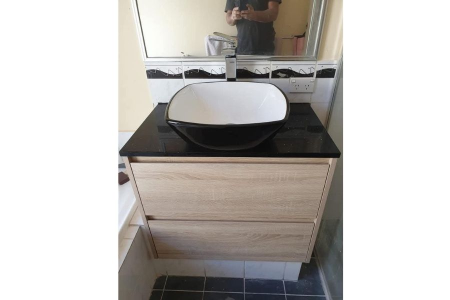 After modern floating vanity and vessel sink installation