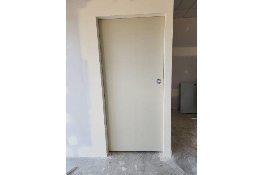 Finished door and painted wall after restoration